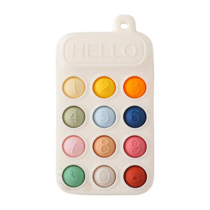Silicone baby teether toy shaped like a cell phone with colorful buttons and the word 'HELLO' on top