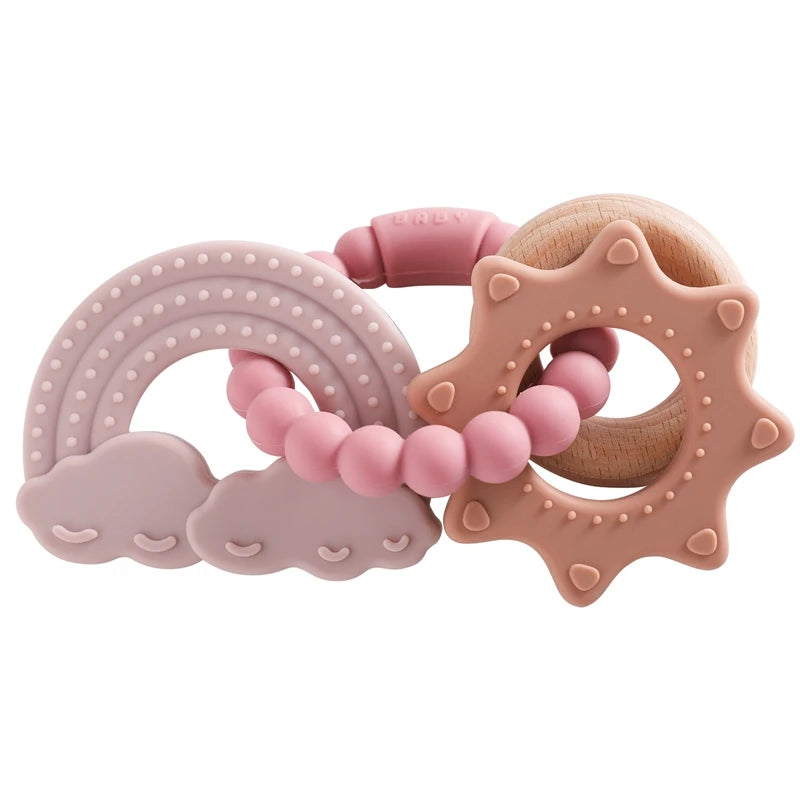 Silicone teether with pink clouds, rainbow, and sun shapes, featuring wooden and silicone beads.