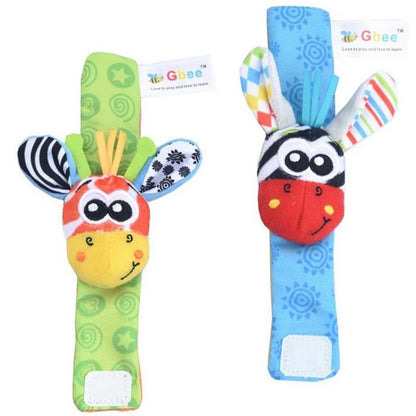 Two colorful baby wrist rattles featuring animal designs, one green with a bird and one blue with a zebra pattern.