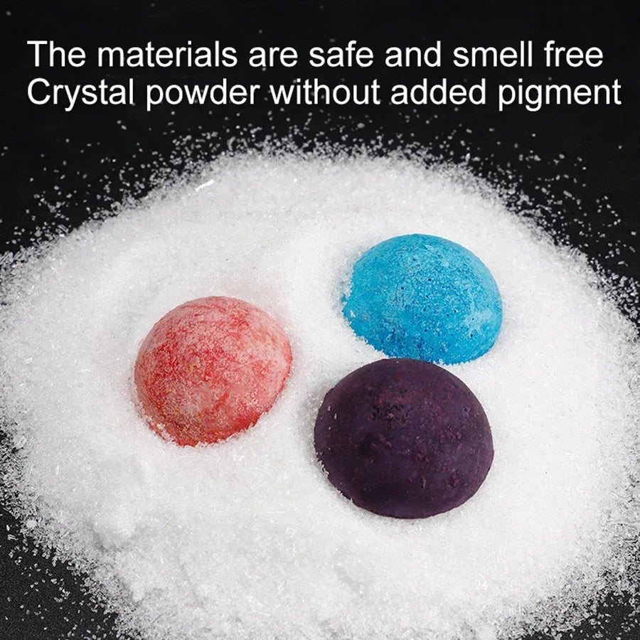 Three colored crystal powders in red, blue, and purple on a white crystalline surface, with text above.