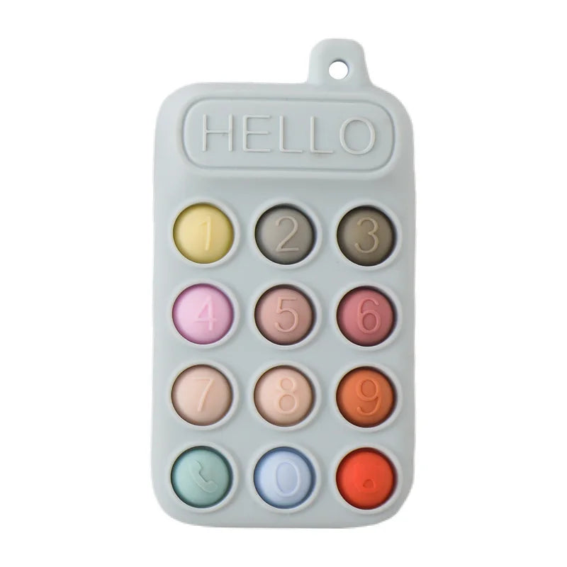 Gray silicone cell phone teether toy with colorful buttons and the word 'HELLO' on top, designed for babies.