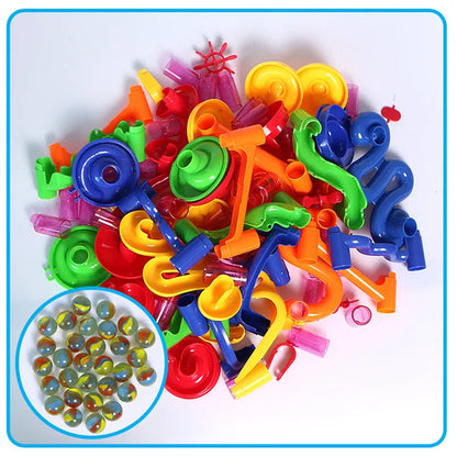 Colorful building blocks and marbles for a marble run race track toy, featuring various shapes and sizes.