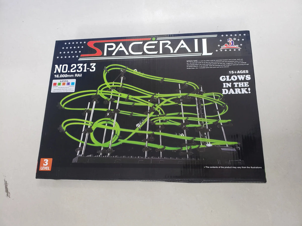 Box of Spacerail marble run maze with green tracks, labeled Level 3, glowing in the dark, educational toy for kids.