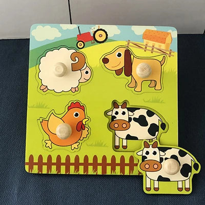 Colorful wooden puzzle featuring farm animals and numbers, with knobs for easy handling, set on a green background.