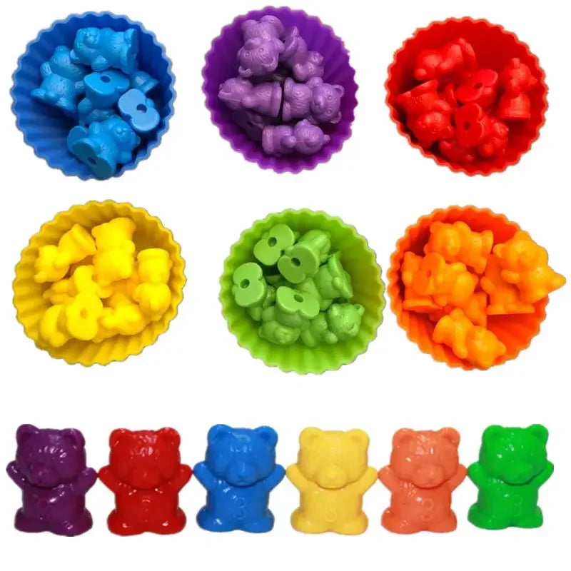 Colorful plastic counting bears in various colors arranged in bowls, including purple, yellow, red, and green.