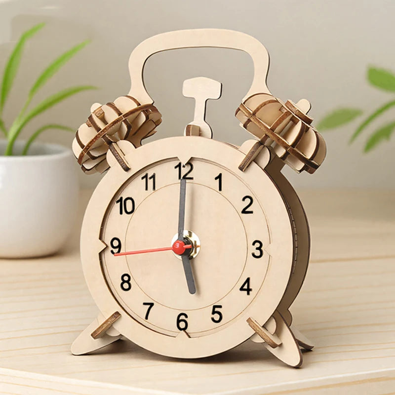 Wooden alarm clock model with a round face, two bells on top, and a red second hand, set on a wooden surface.