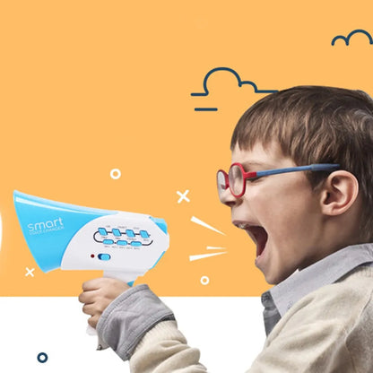 Child using a blue and white voice changer loudspeaker toy, smiling and having fun.