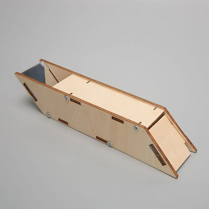 Simple periscope made of light wood with angled sides and a black viewing tube, designed for kids' STEM projects.