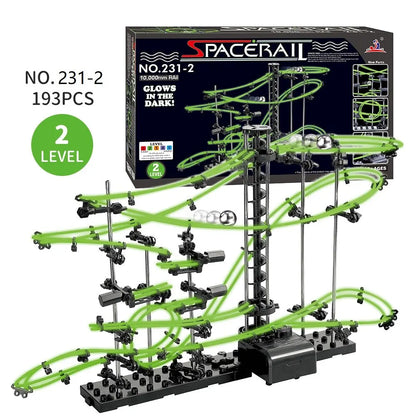 Luminous marble run maze with green tracks, black supports, and an electric elevator, featuring 193 pieces.