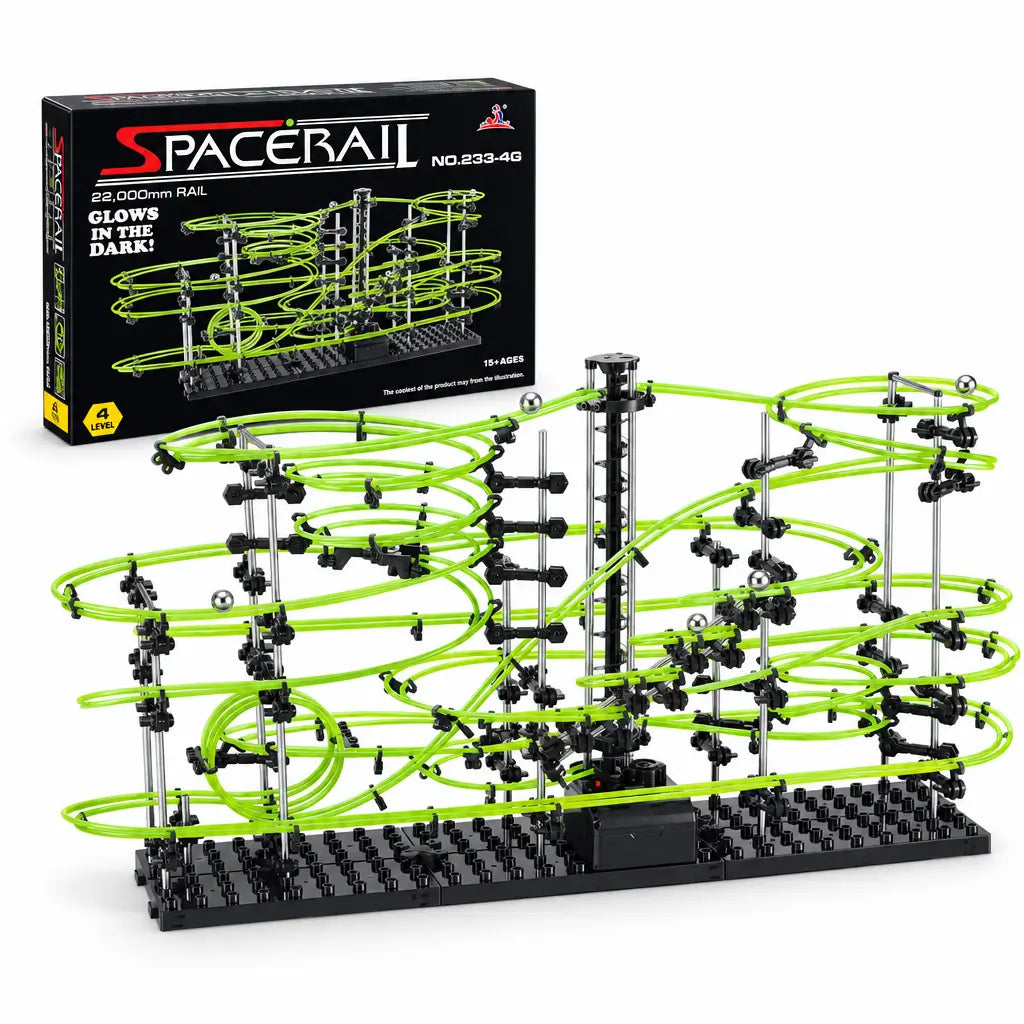 Luminous marble run maze with green rails and black base, featuring an electric elevator, in front of a box.
