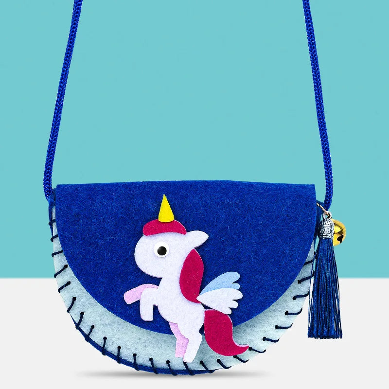 Blue and light blue felt crossbody purse with a unicorn design, featuring a tassel and a blue strap.