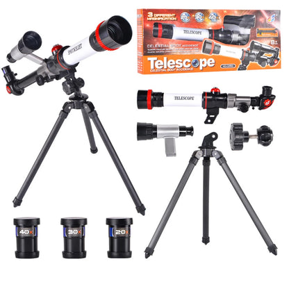 Astronomical telescope with red accents, three eyepieces, and a tripod, packaged with accessories for kids.