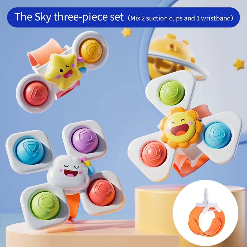 Three-piece set of colorful suction cup spinning top toys featuring cartoon animals and a watch band.