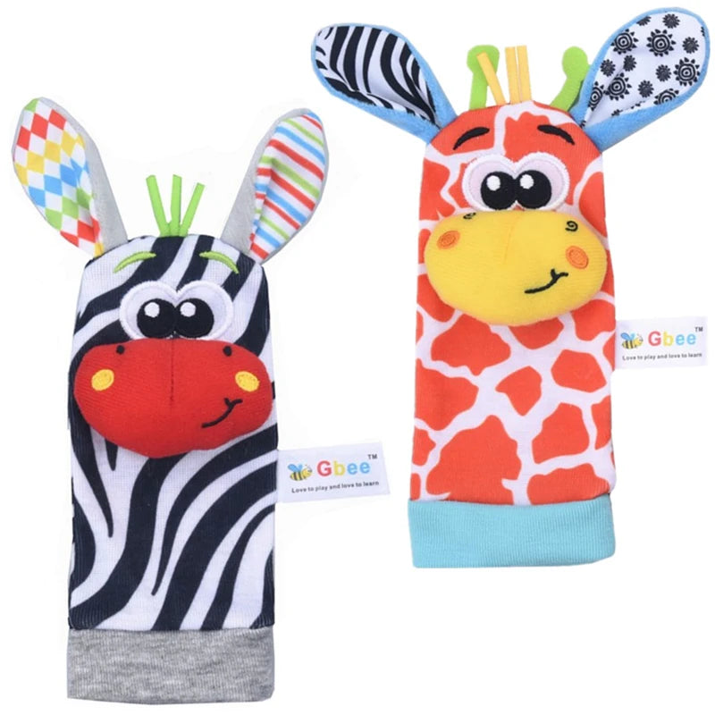 Two pairs of baby socks designed as animal characters, featuring a zebra and a giraffe with colorful patterns and details.