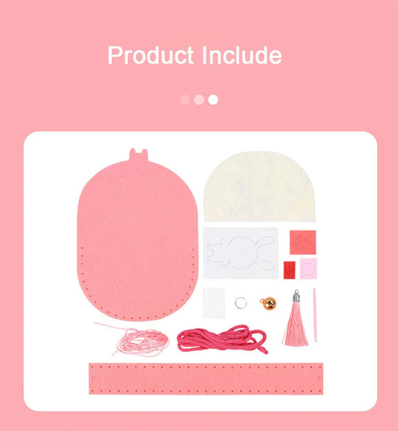 Pink non-woven fabric sewing kit with various pieces including a purse shape, thread, tassel, and accessories.