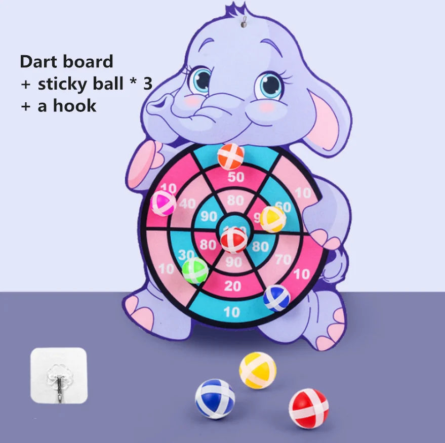 Cartoon elephant dart board with colorful target and three sticky balls in red, blue, and yellow.