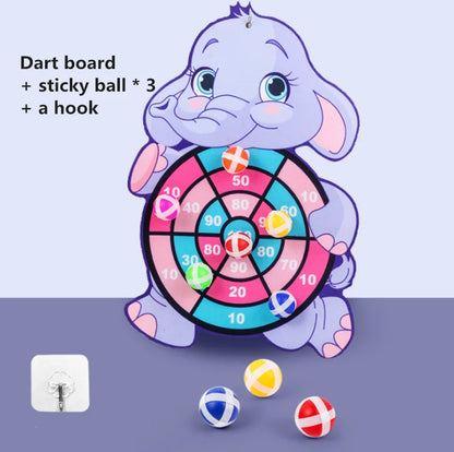 Cartoon elephant dart board with colorful target and three sticky balls in red, blue, and yellow.