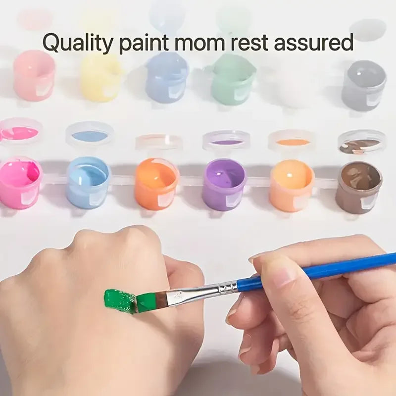 A hand holding a paintbrush with green paint, surrounded by small paint pots in various colors.