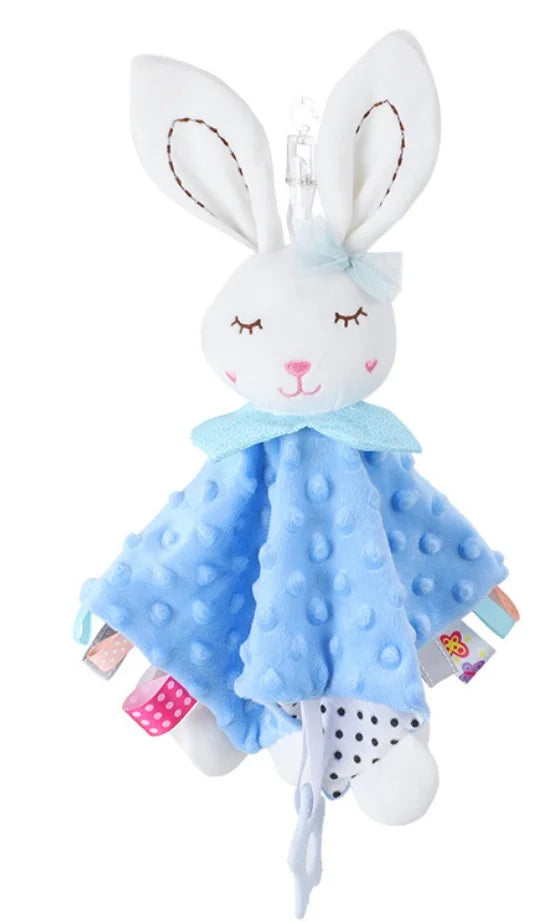 Plush blue rabbit comforter with a white bunny head, soft fabric, and colorful tags attached.