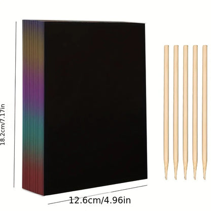 50 black scratch paper sheets with rainbow edges and five wooden styluses for kids' art projects.