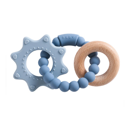 Blue silicone teether shaped like a star with textured points, connected to a wooden ring and blue beads.