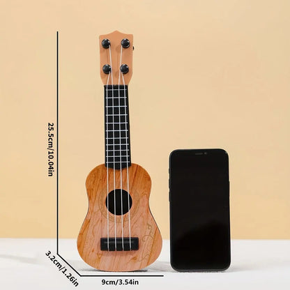 Mini classical ukulele guitar toy with a wooden finish, next to a smartphone for size comparison.