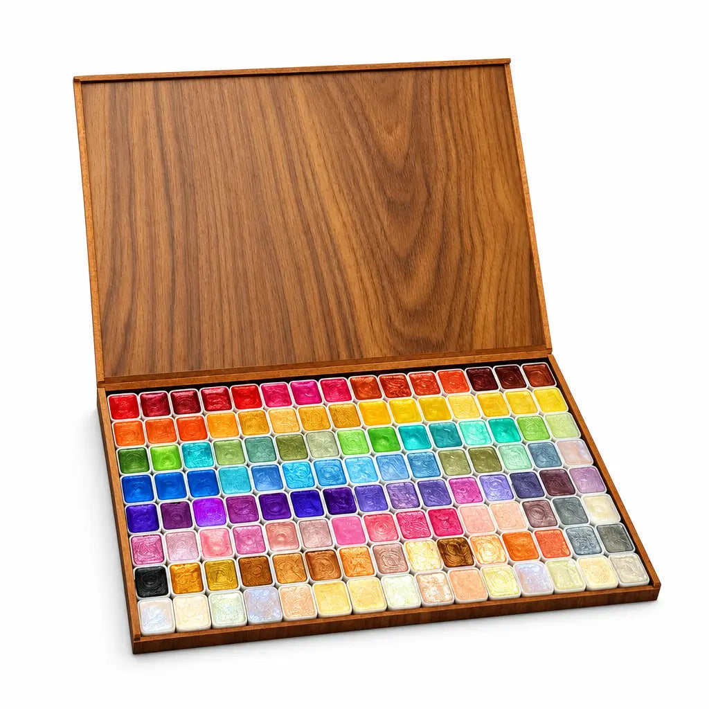 Glitter watercolor set on a white studio background